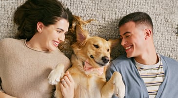 Nationwide member Tim A. hugging his Malinois, Ziya