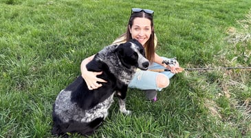 Nationwide member Tim A. hugging his Malinois, Ziya