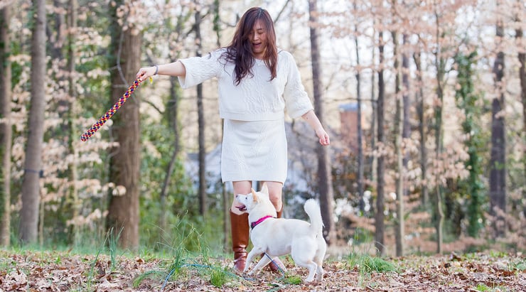 Euna playing with Belle in the backyard