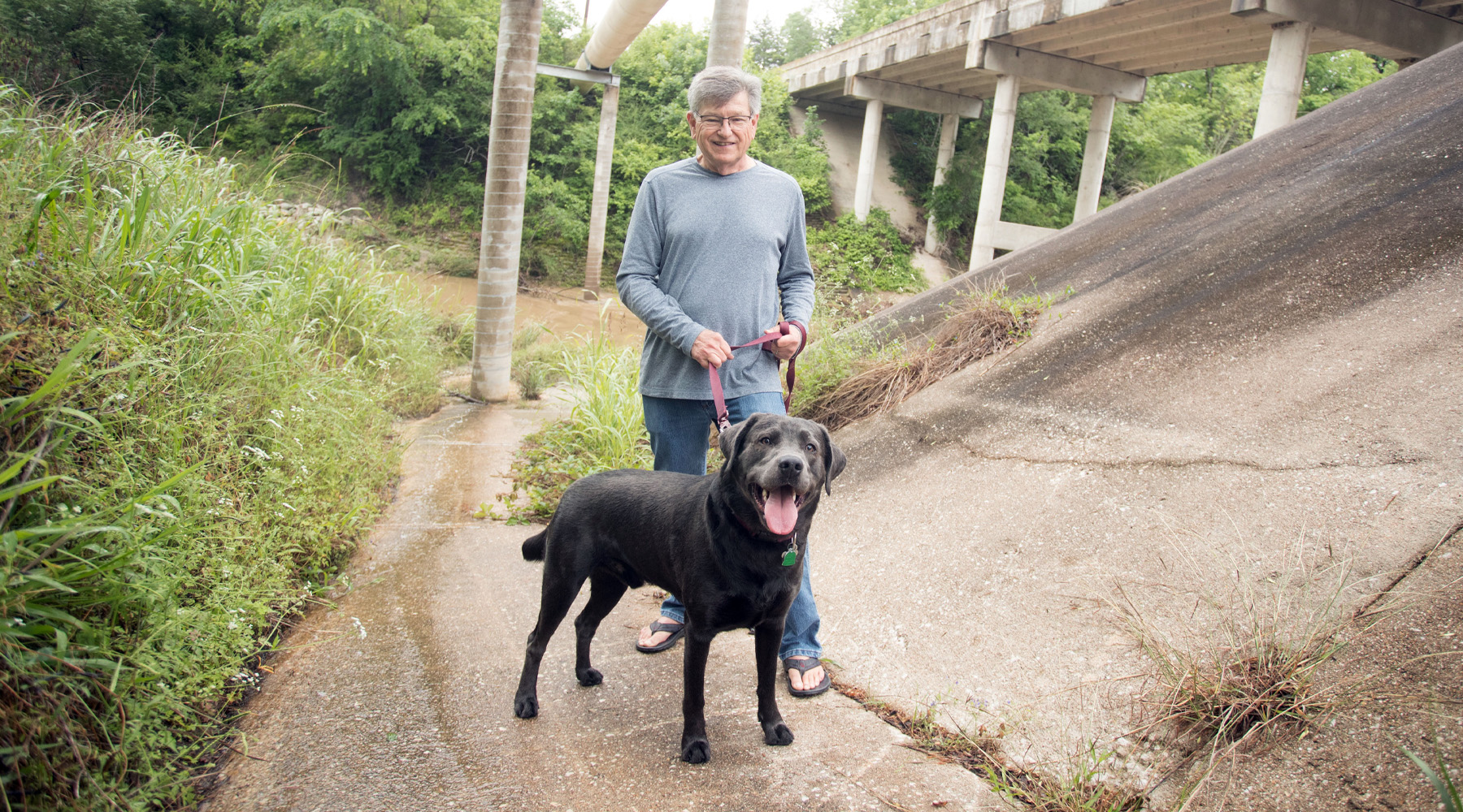 Mark and Grayson Haze at the bottom of the embankment under the bridge